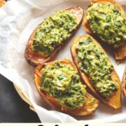 Sweet potato boats with spinach filling on top on paper.