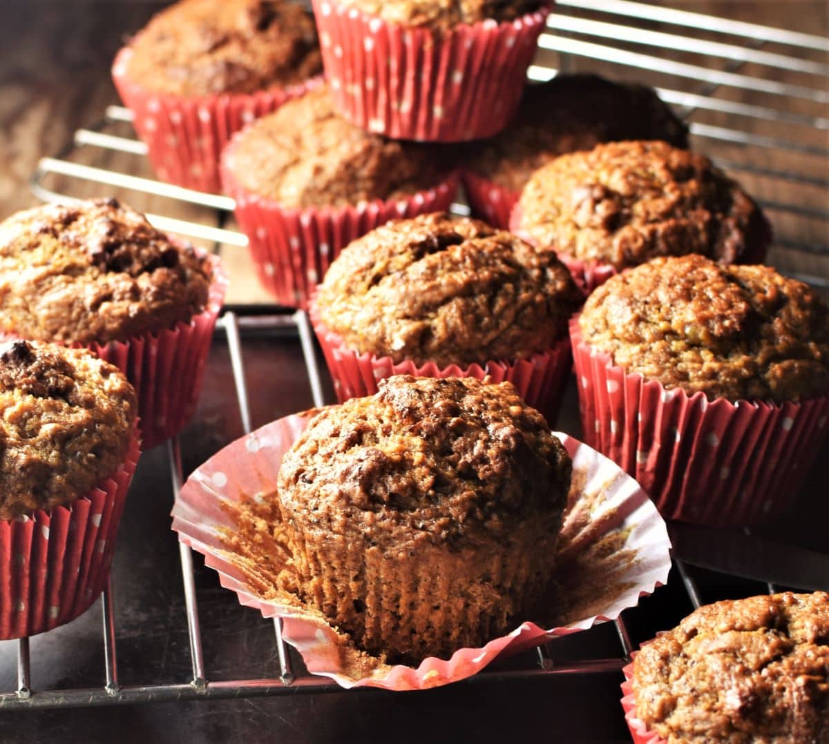 Side view of carrot muffins in red cases.