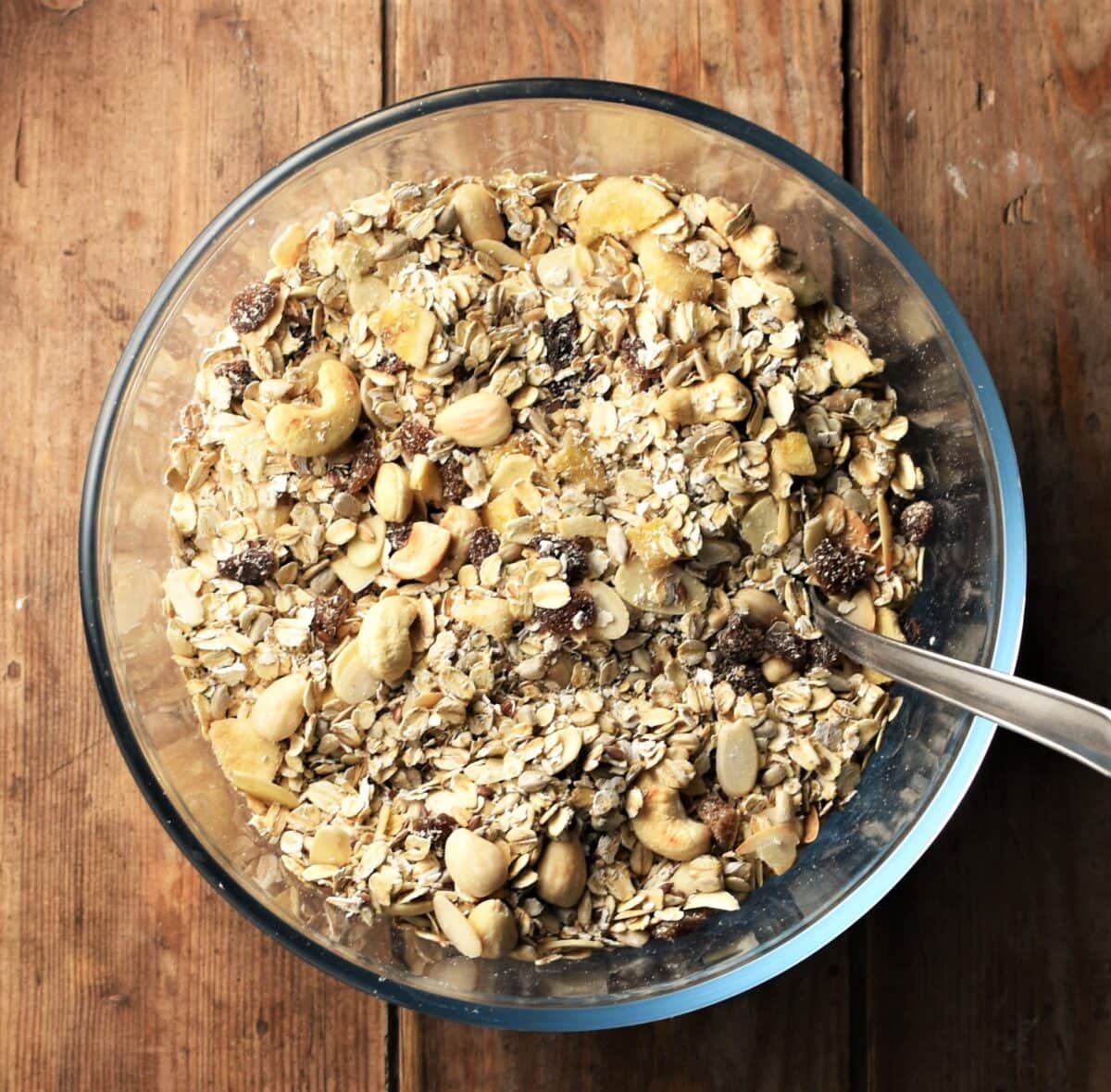 Muesli in mixing bowl with spoon.