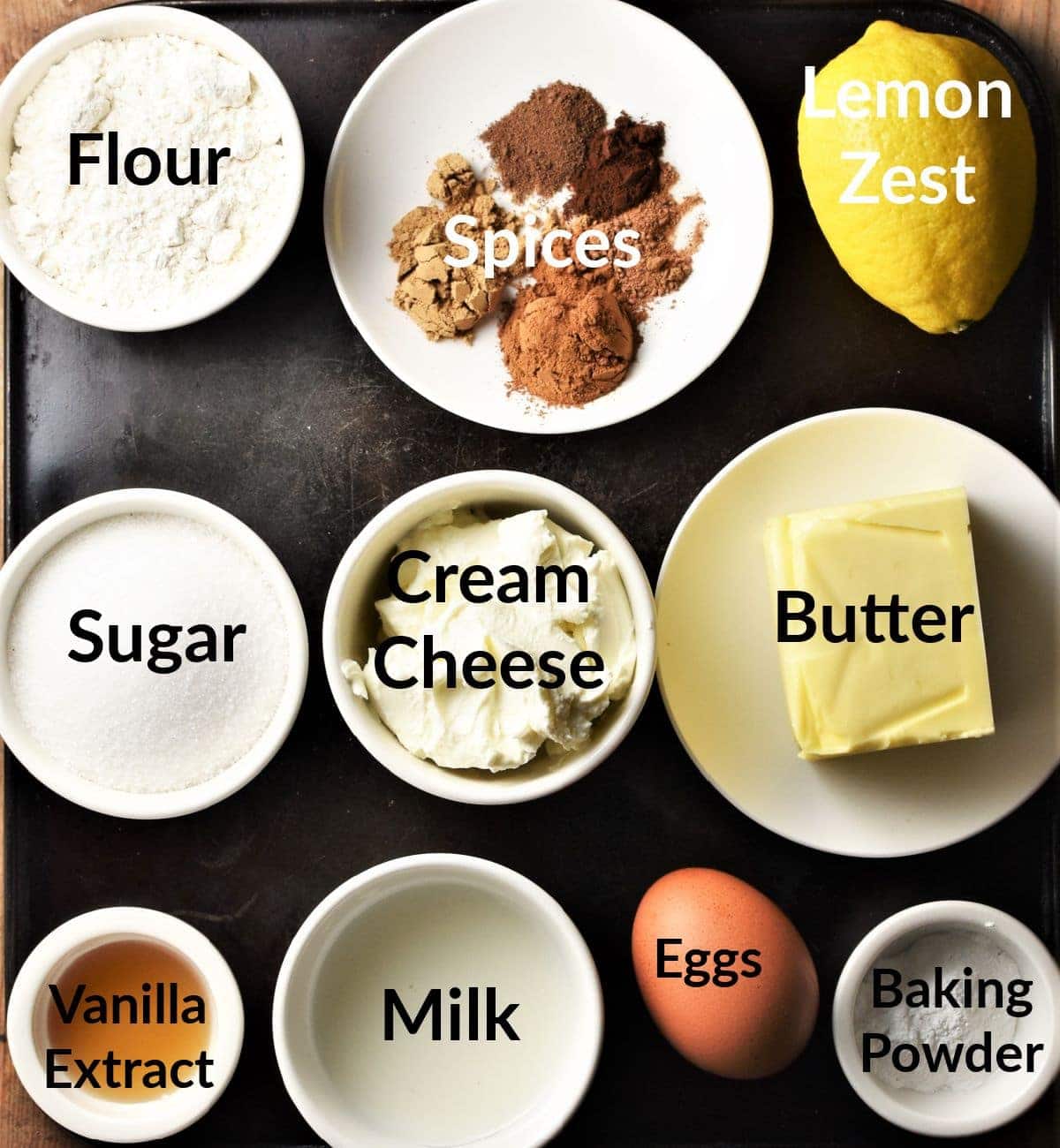 Pumpkin spice cupcakes ingredients in individual dishes.