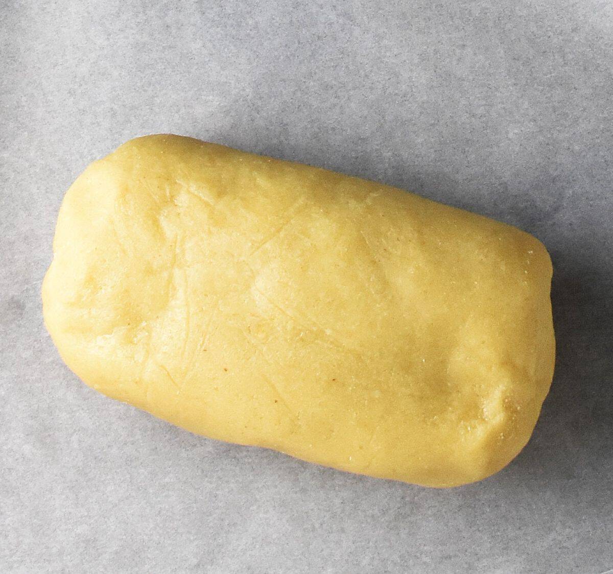 Pastry log on parchment paper.
