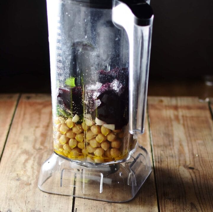 Chickpeas and chopped beets inside blender.