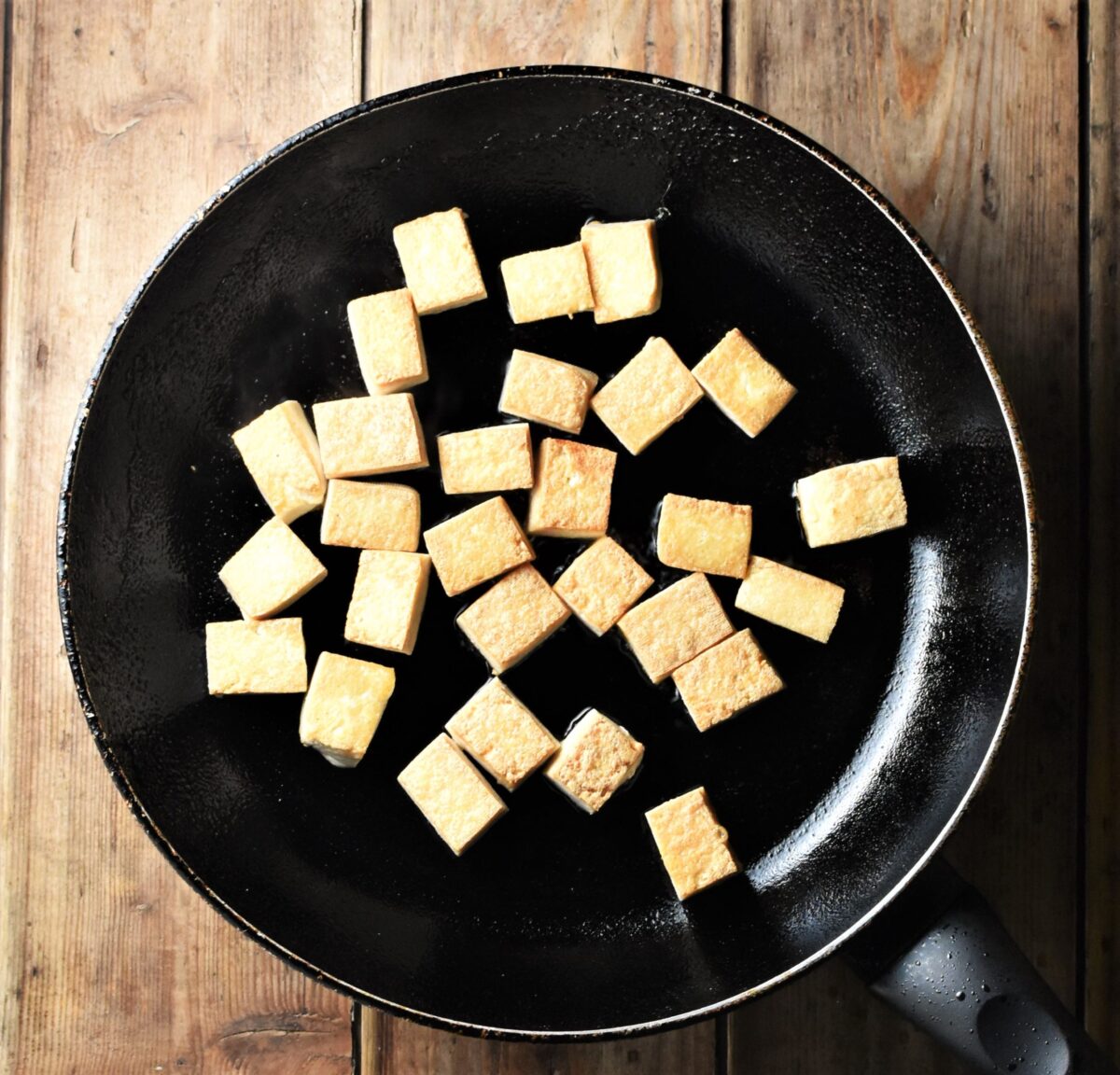 Cubed tofu in large pan.