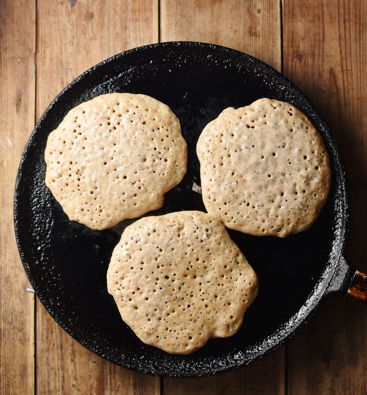 3 pancakes on top of pan.