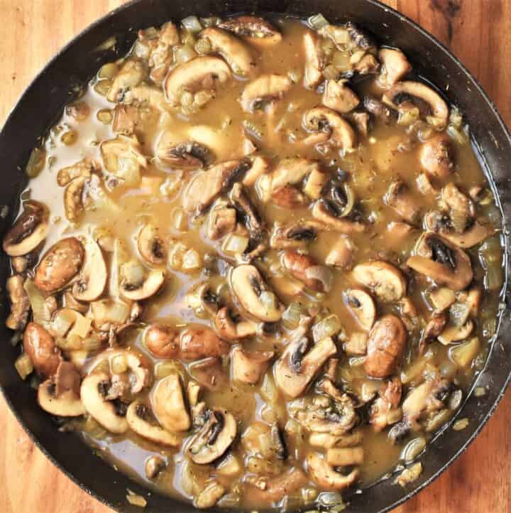 Mushroom sauce for chicken casserole in shallow pan.