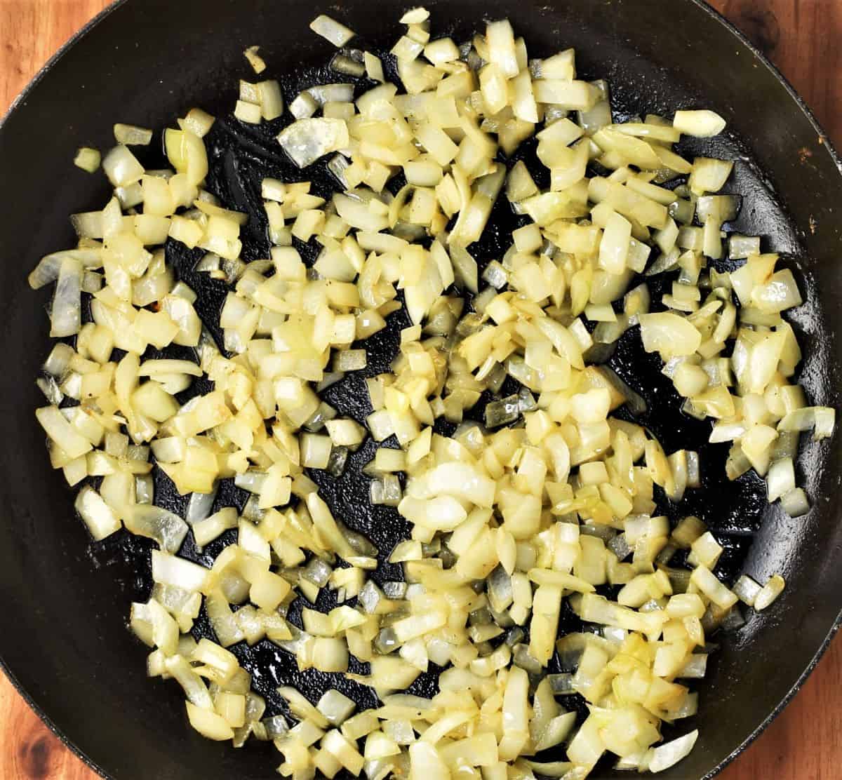 Frying chopped onion in large pan.