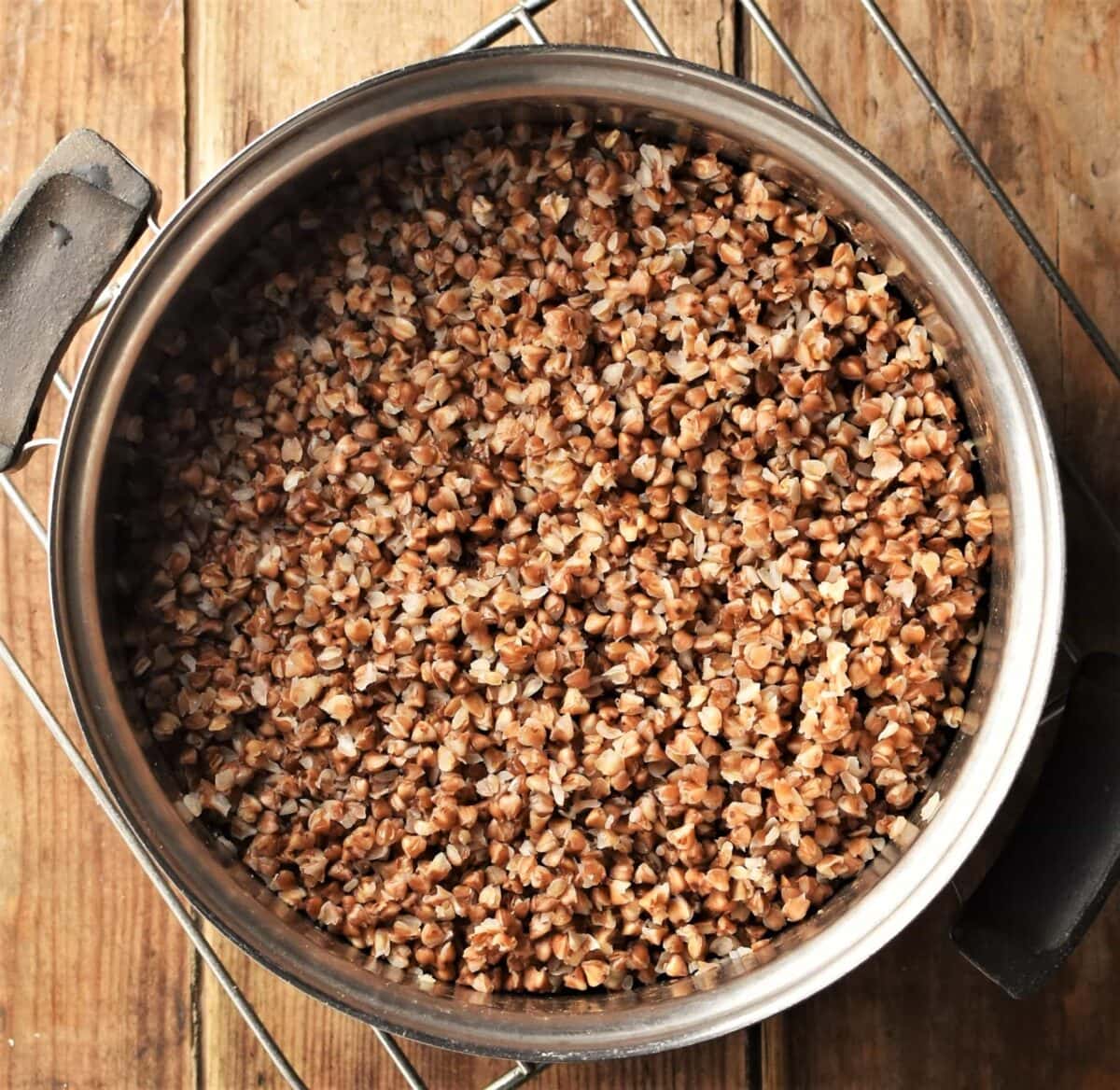 Top down view of cooked buckwheat in pot.