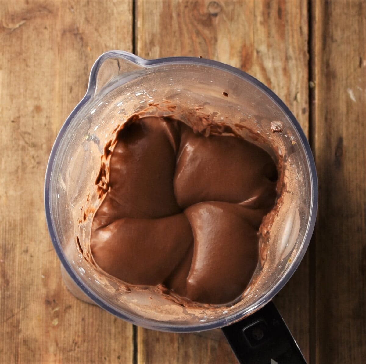 Creamy chocolate mousse mixture in blender.