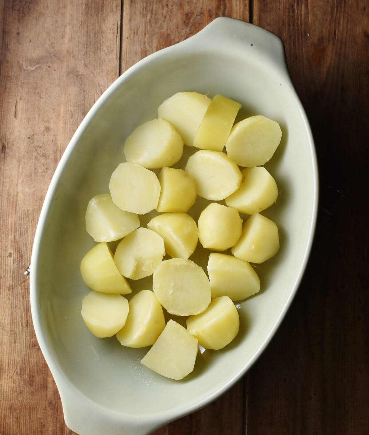 Potato pieces in oval dish.