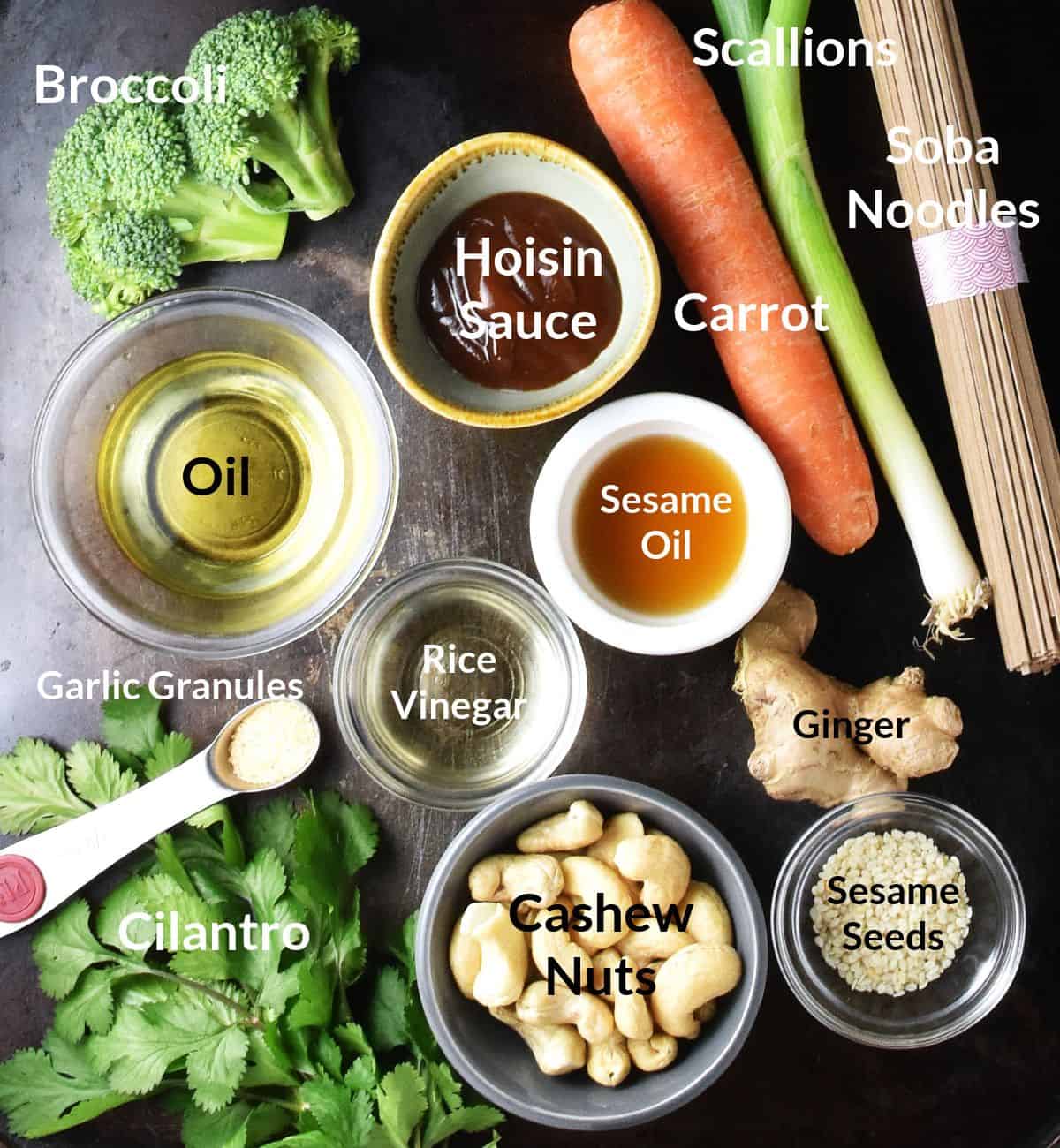 Top down view of ingredients for making broccoli and noodle salad in individual dishes.