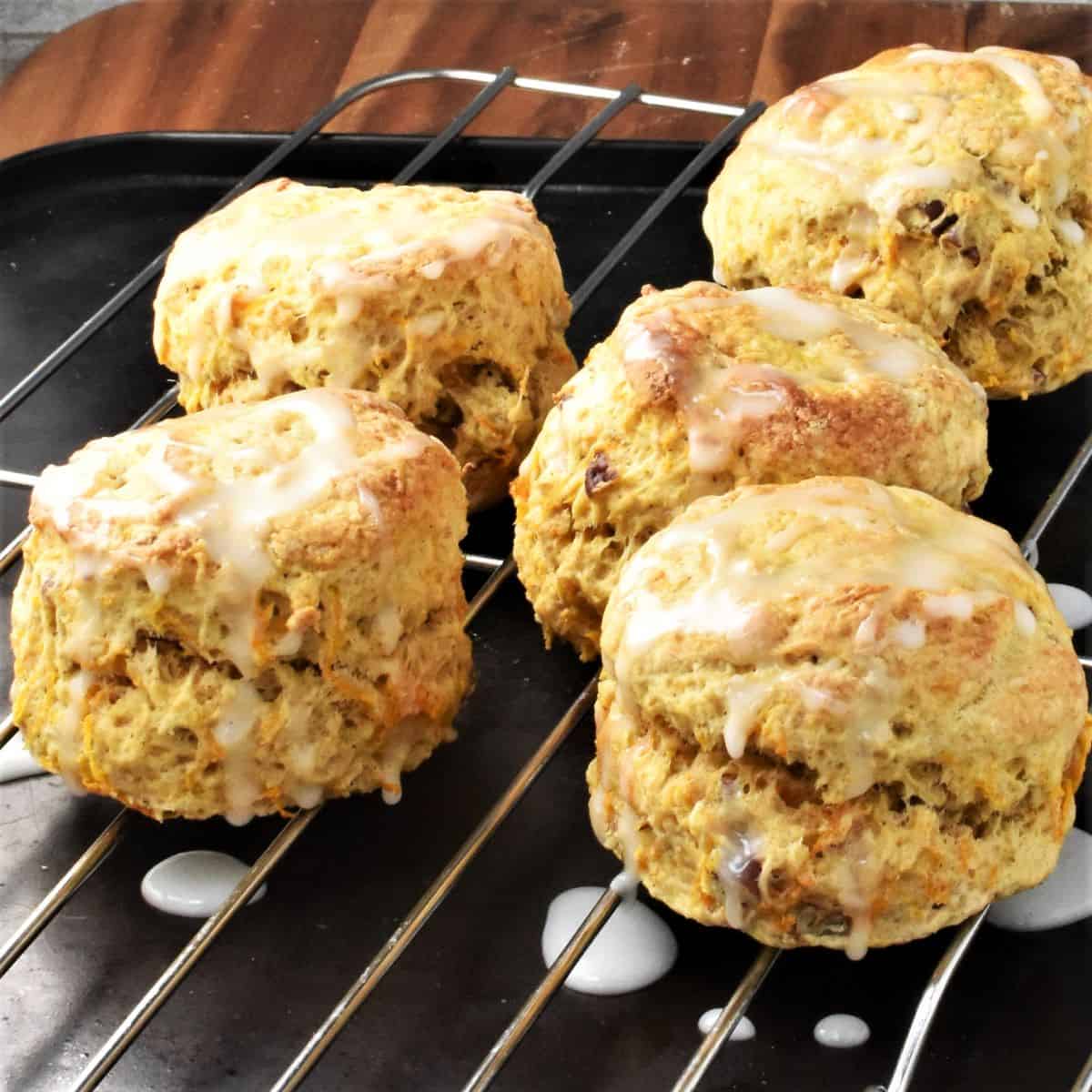 Side view of 5 carrot scones on top of rack.