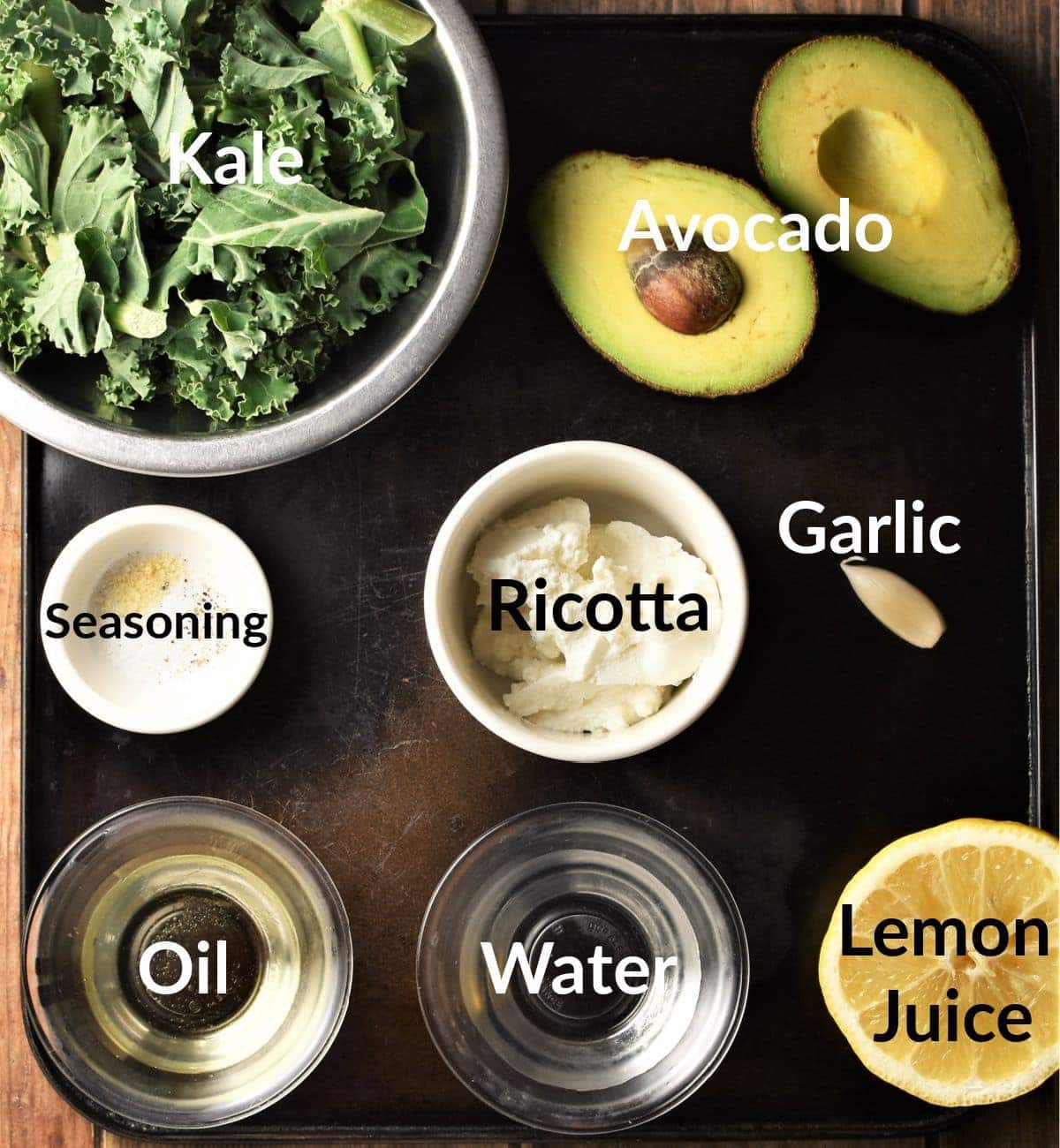 Kale dip ingredients in individual dishes.
