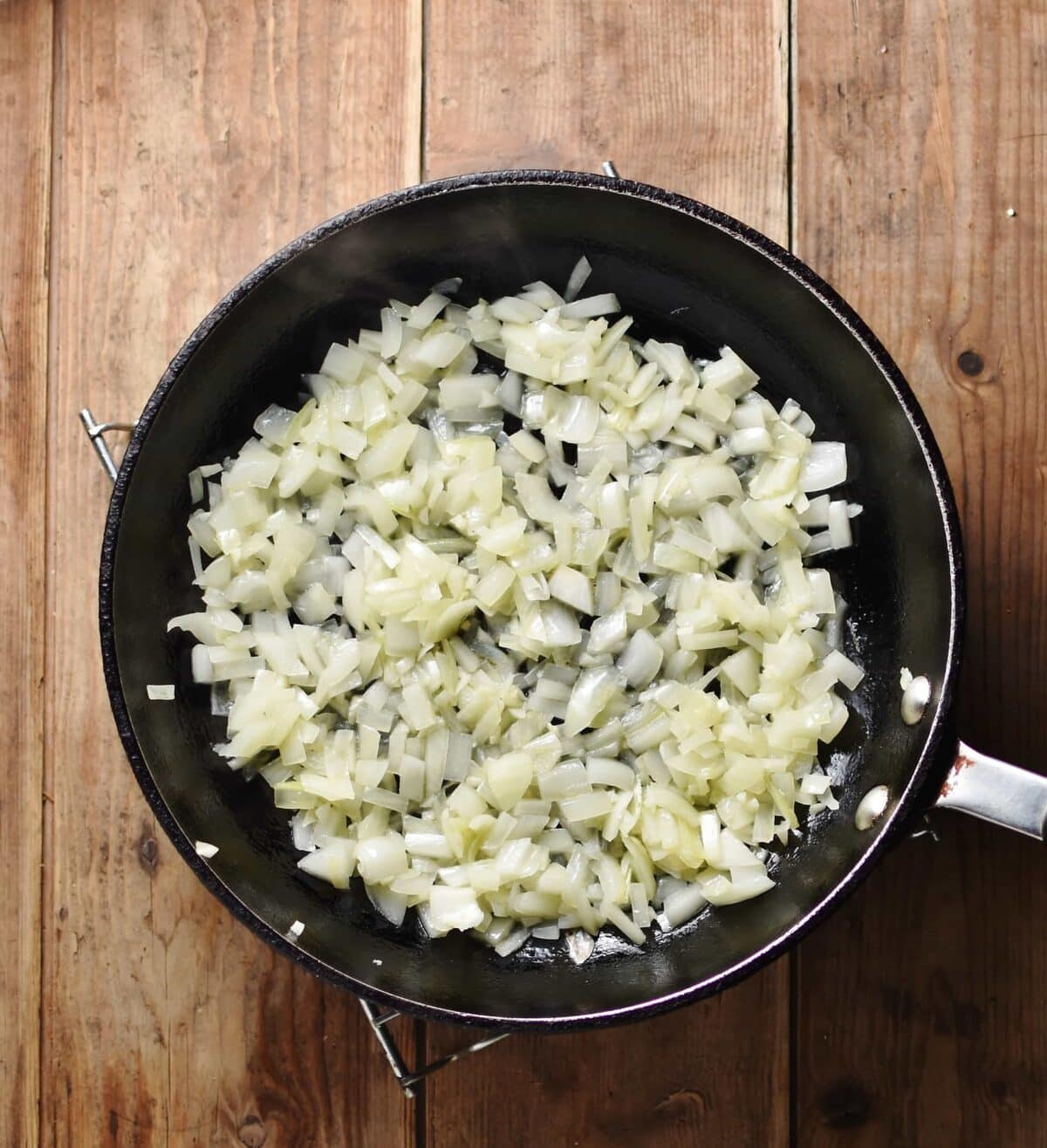 Top down view of fried onions in shallow pan/