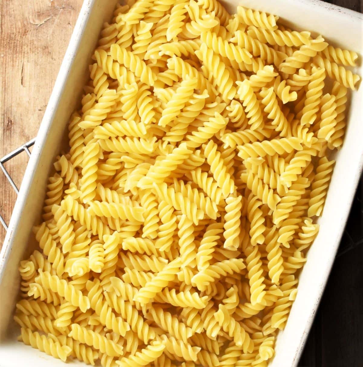 Fusilli pasta in rectangular dish.