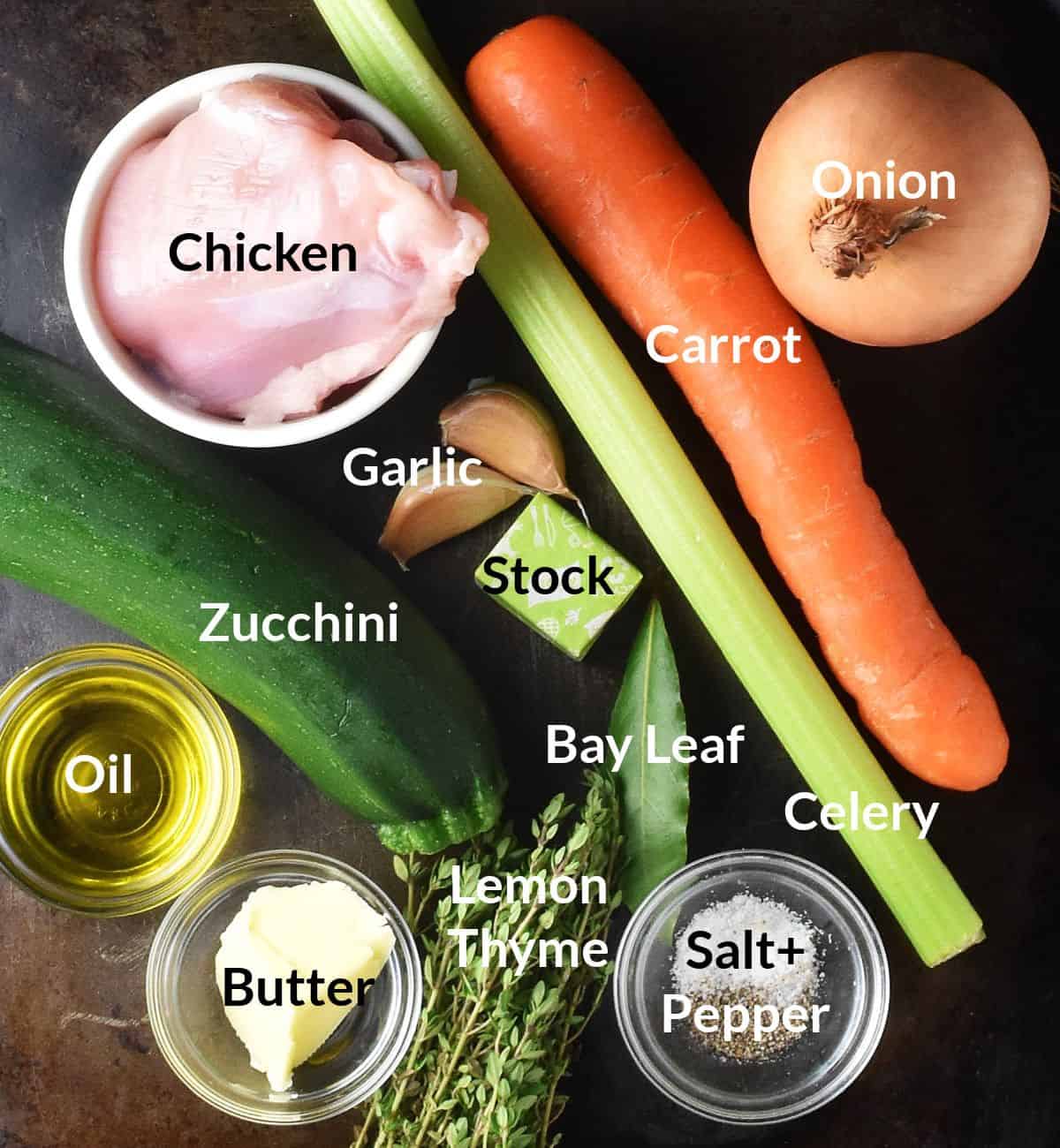 Top down view of ingredients for making chicken zucchini soup in individual dishes.