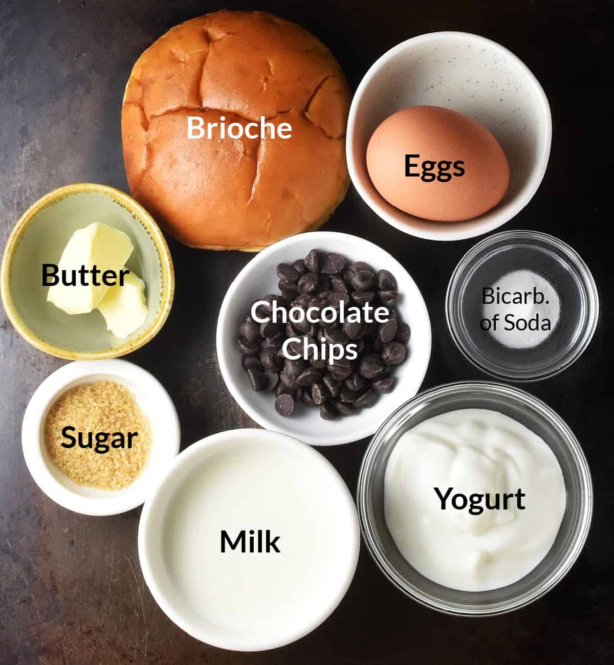 Top down view of french toast muffin ingredients in labelled individual dishes.