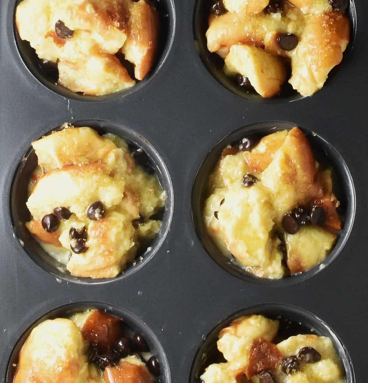 Raw french toast cup mixture in muffin pan.