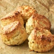 Side view of cauliflower scones on top of parchment.