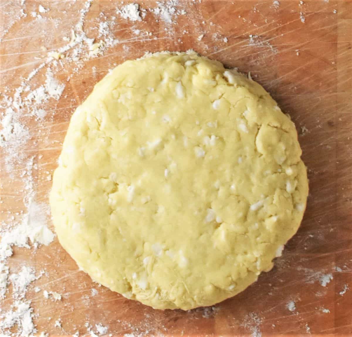 Top down view of round cauliflower scones dough.