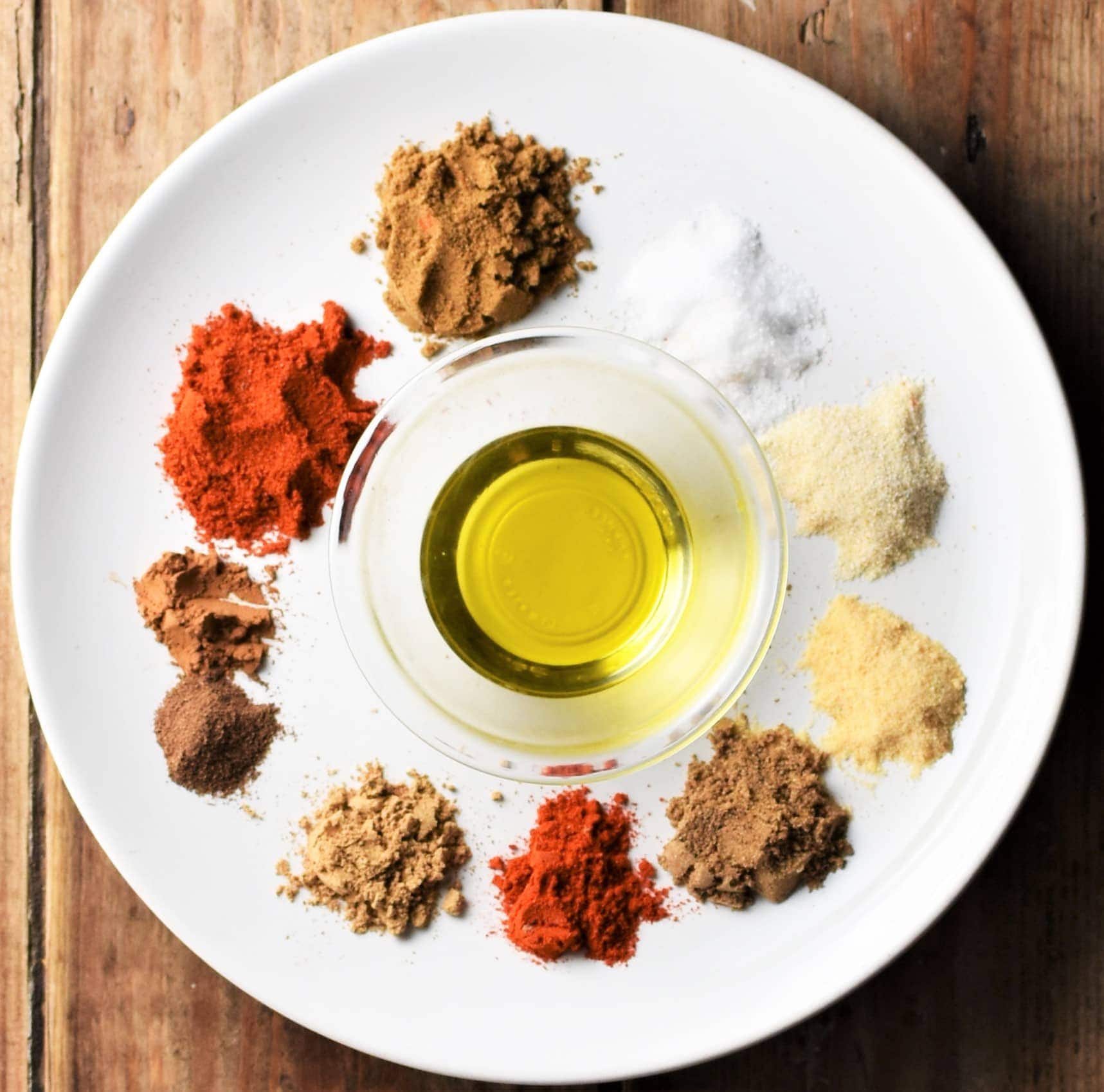 Spices and oil on top of plate.