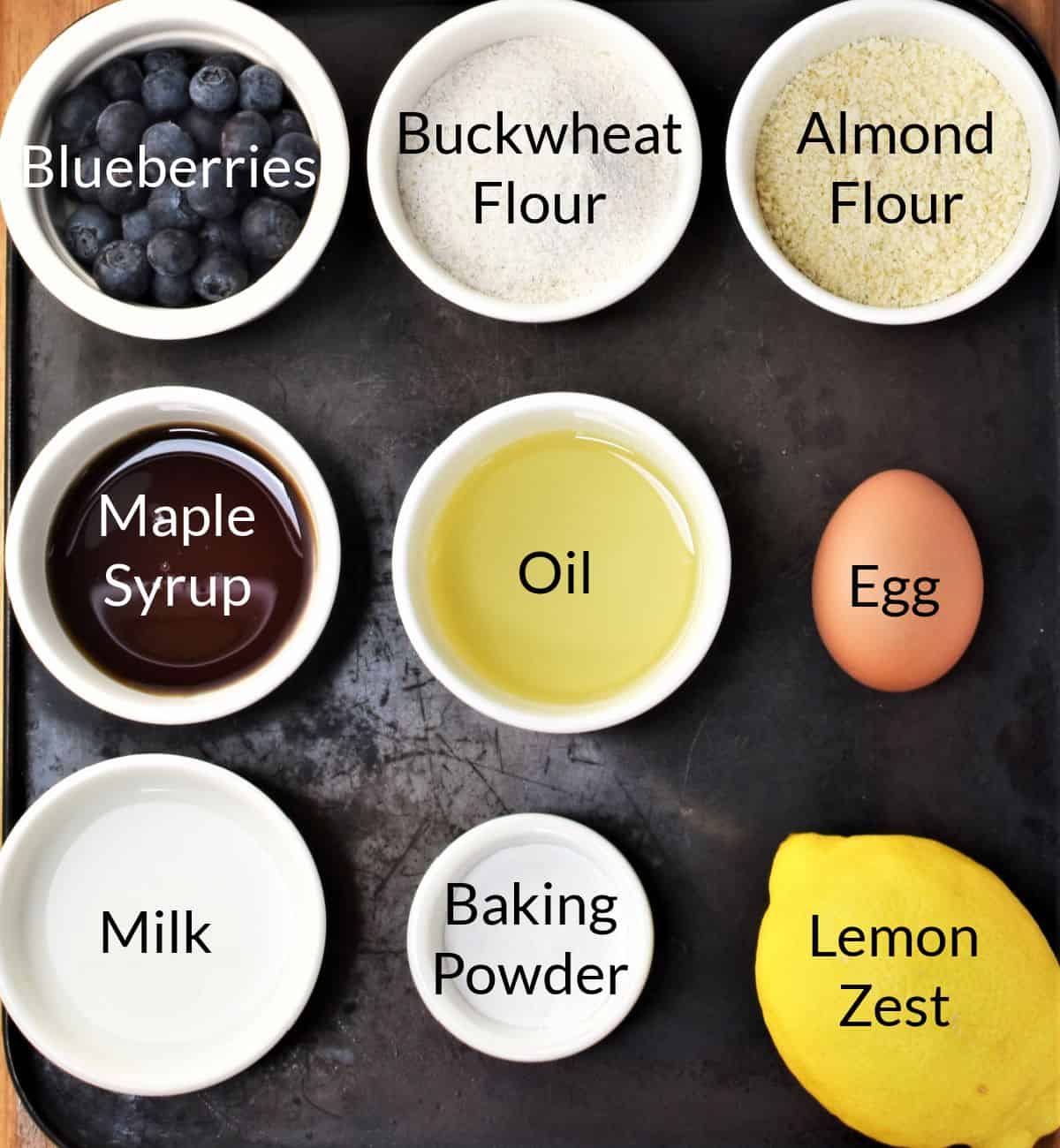 Ingredients for making gluten free blueberry muffins in individual dishes.