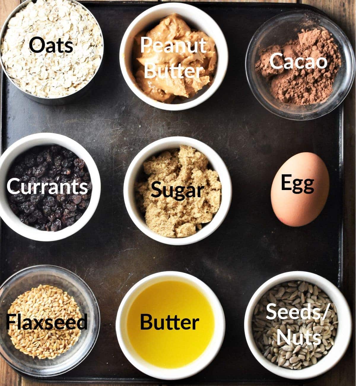 Healthy chocolate oatmeal cookies ingredients in individual dishes.