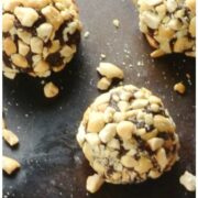 Close-up side view of Chocolate Peanut Butter Energy Balls on oven tray.