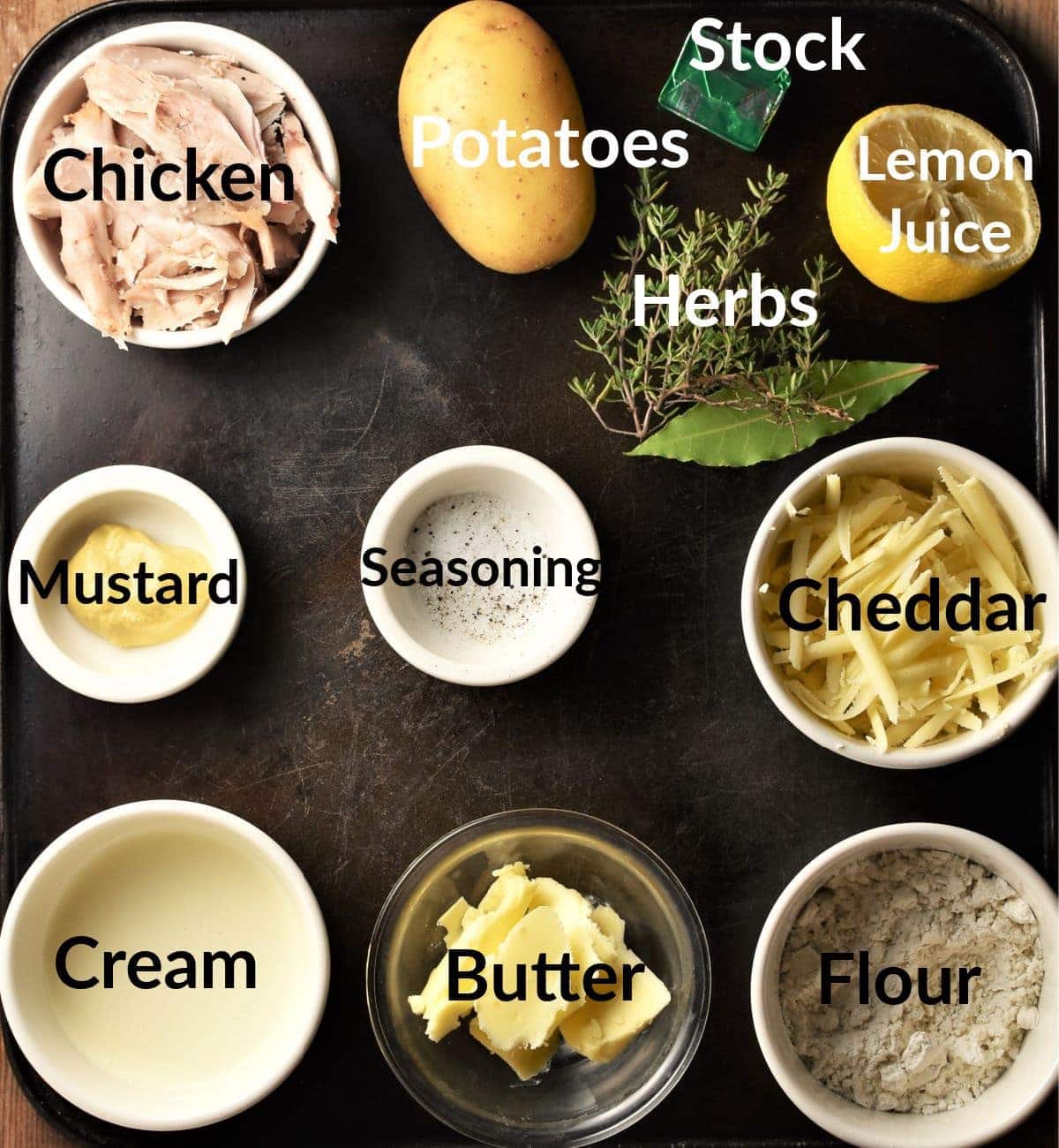 Chicken and potato bake ingredients in individual dishes.