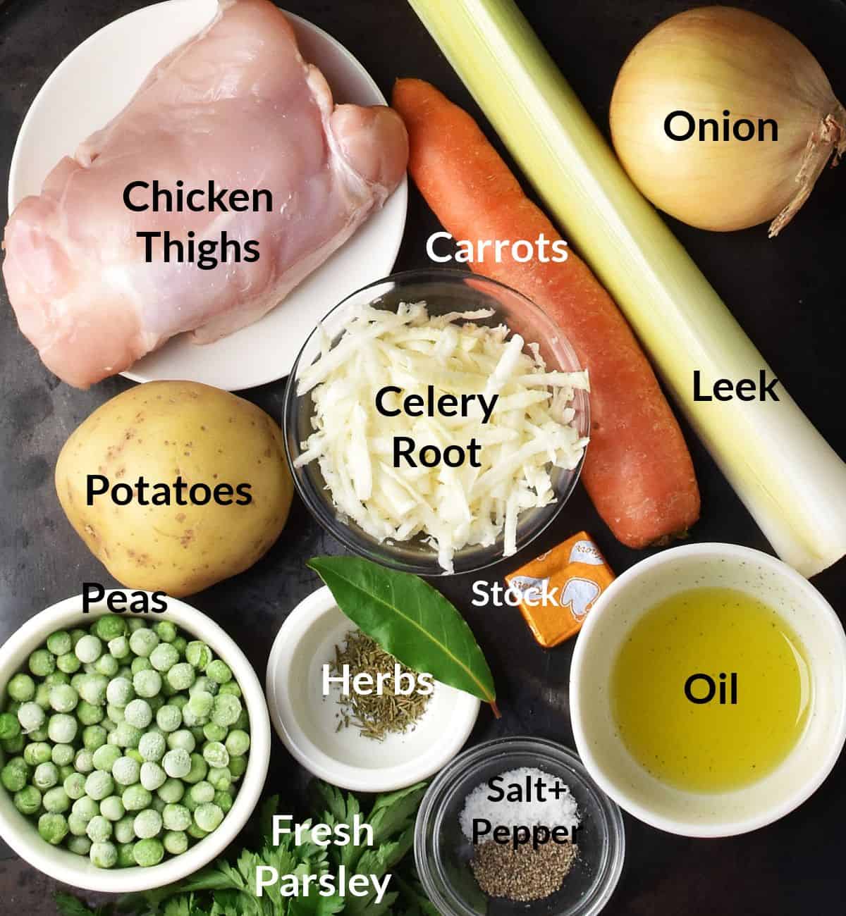 Top down view of chicken and potato soup ingredients in individual small dishes with labels.