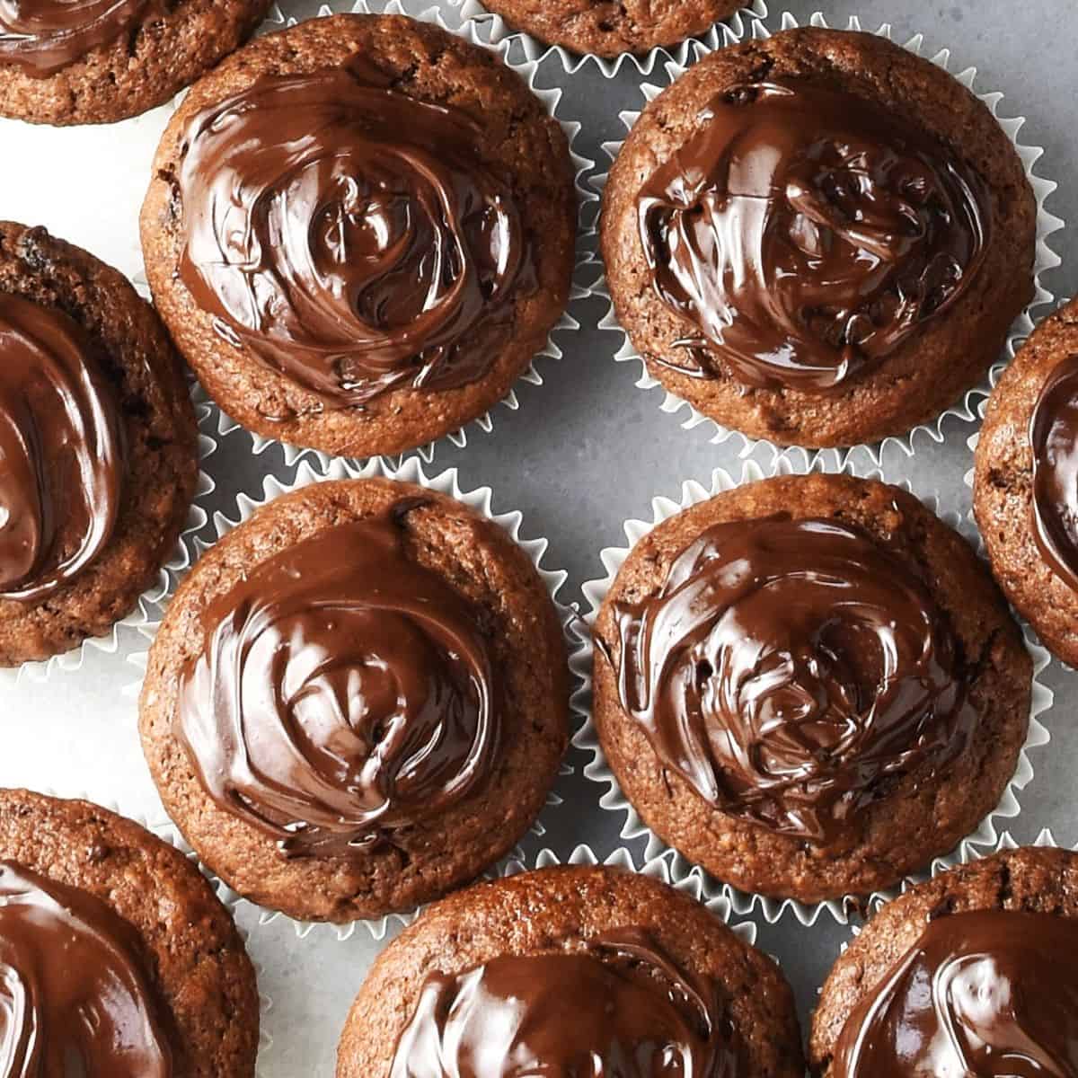 Top down view of gingerbread muffins with chocolate glaze.