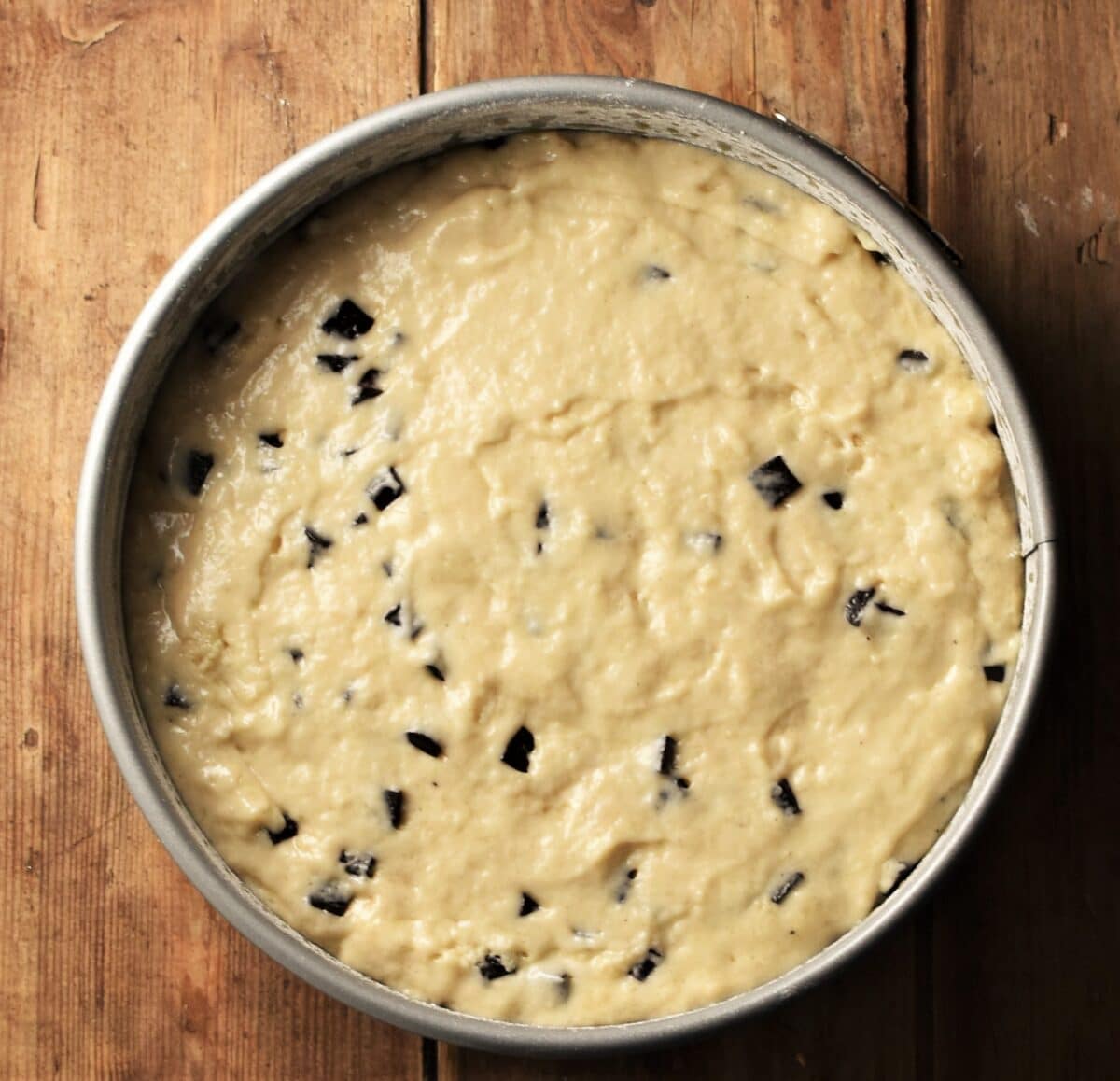 Marzipan cake batter in round pan.