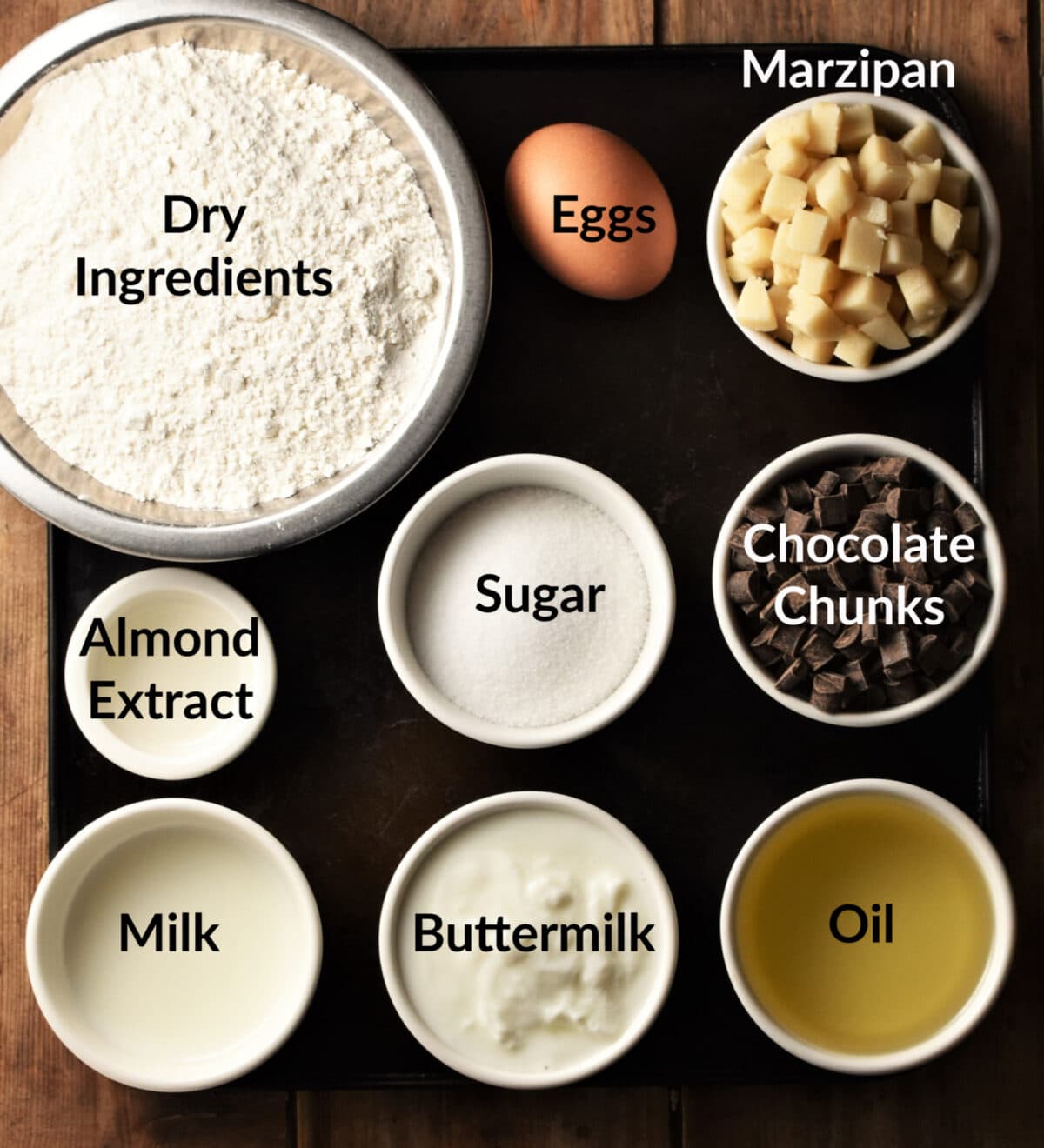 Marzipan cake ingredients in separate small dishes.