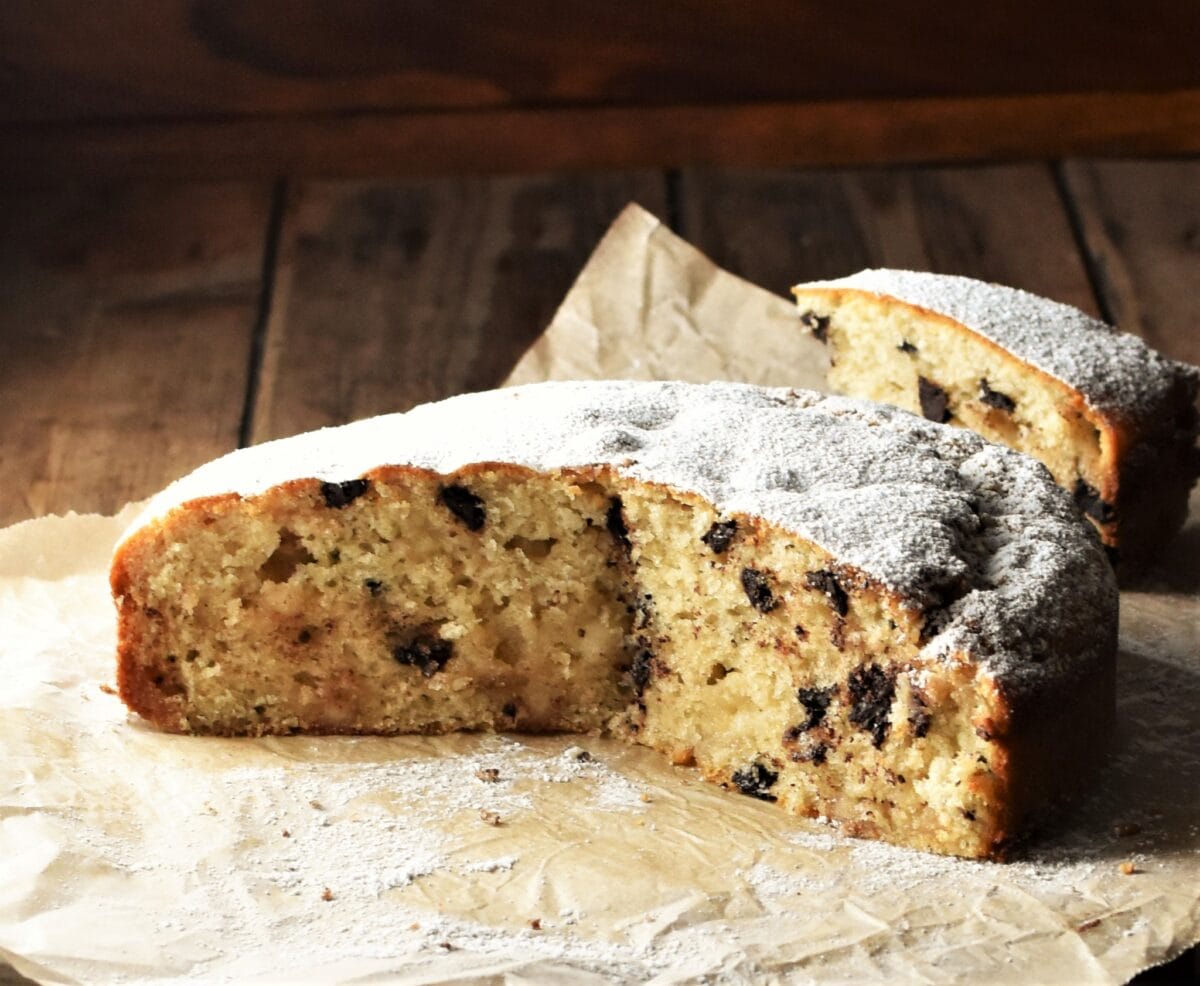 Marzipan cake, cut, on top of paper.