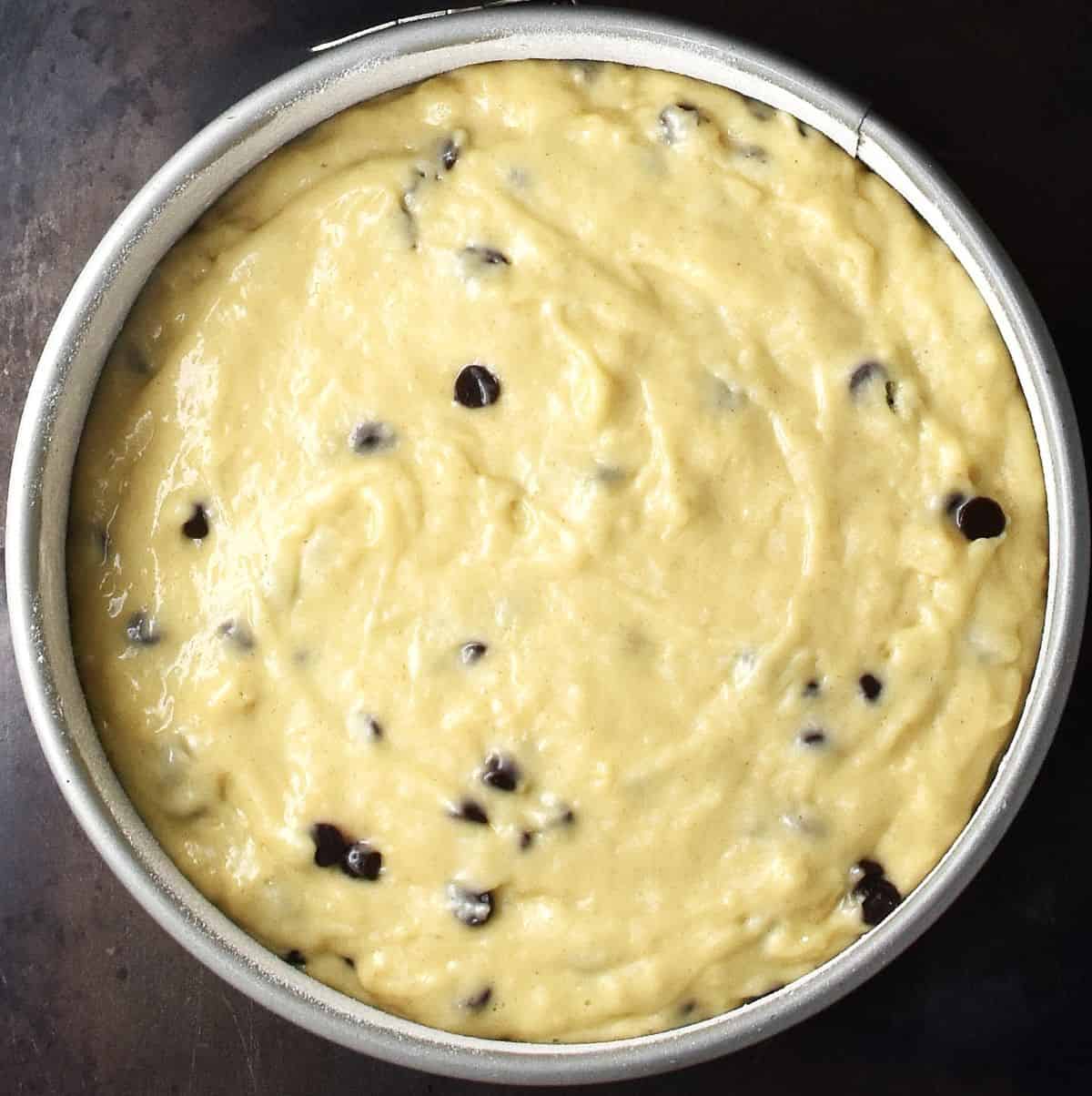 Marzipan cake batter in round tin.