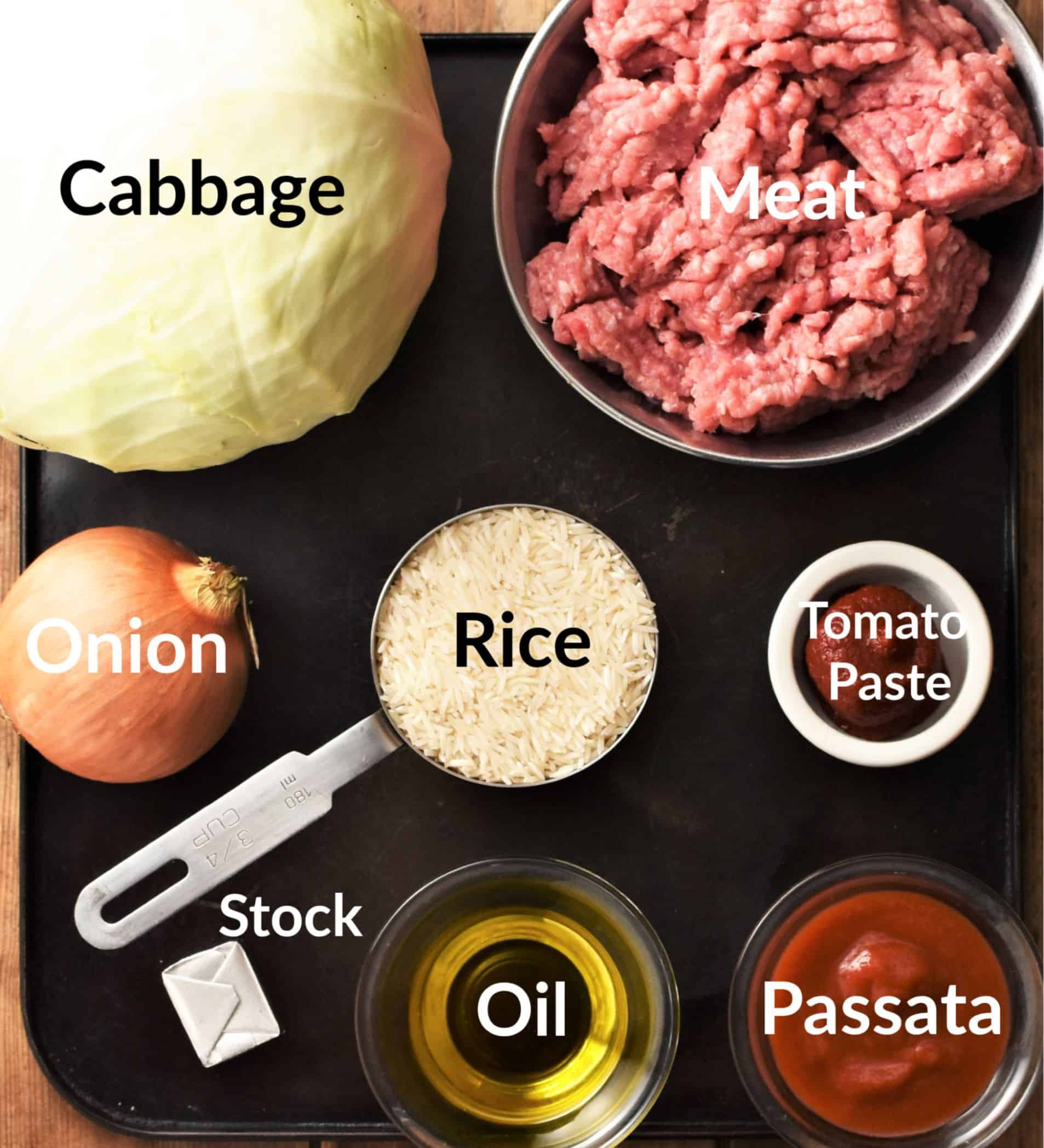 Cabbage rolls ingredients in individual dishes.