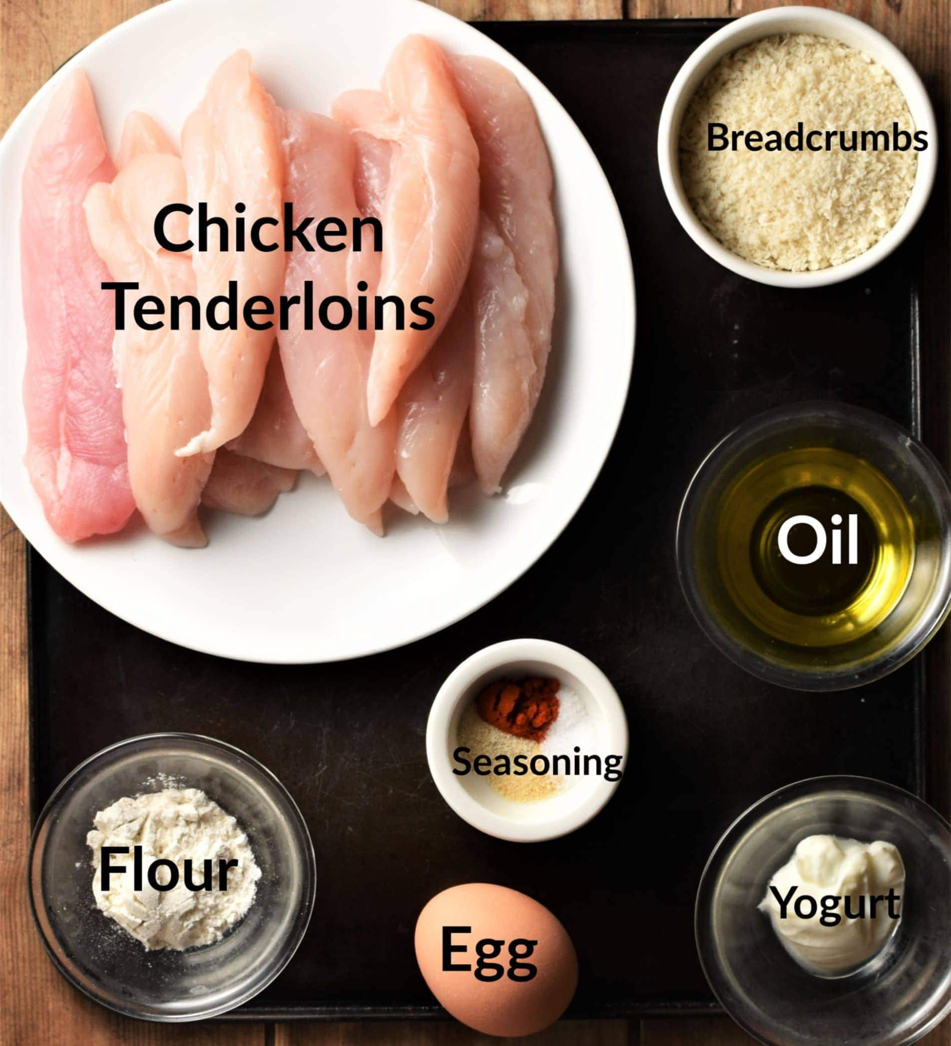 Chicken tenders ingredients in individual dishes.
