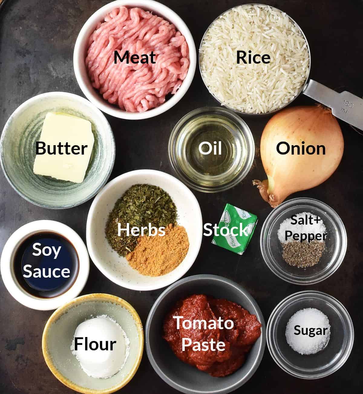 Ingredients for Polish cabbage rolls in individual dishes with labels.