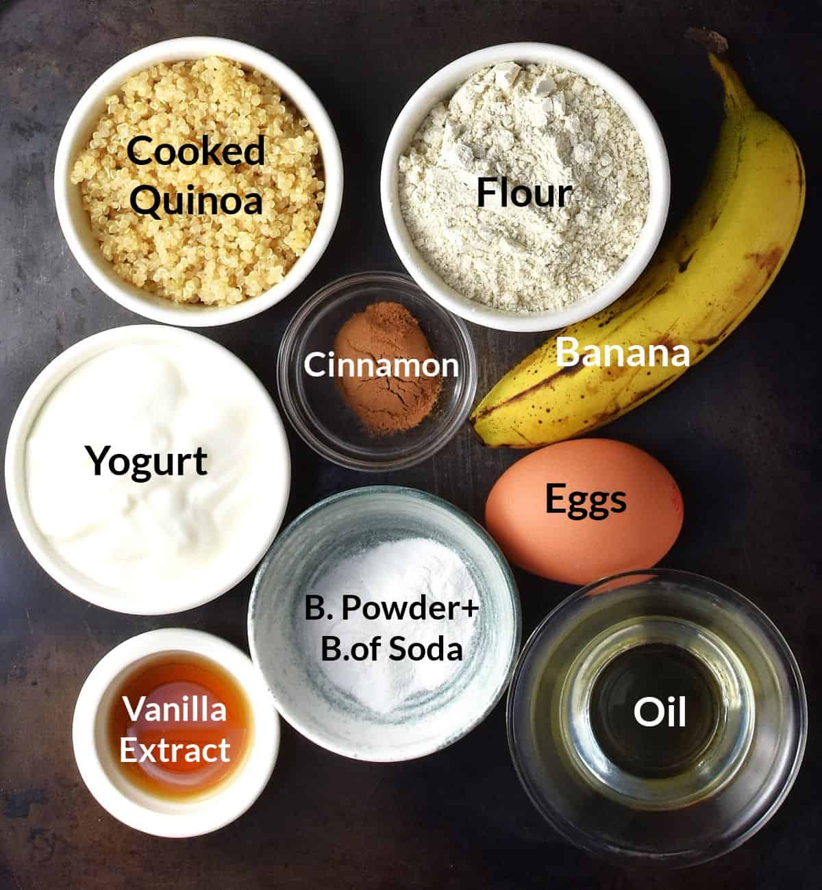 Top down view of ingredients for banana quinoa pancakes in small dishes with labels.