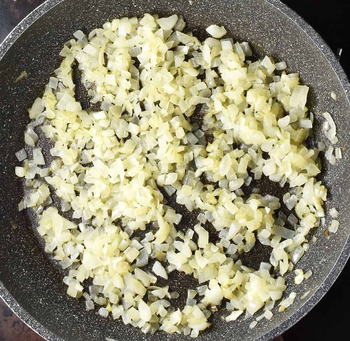 Finely chopped sauteed onion in large pan.
