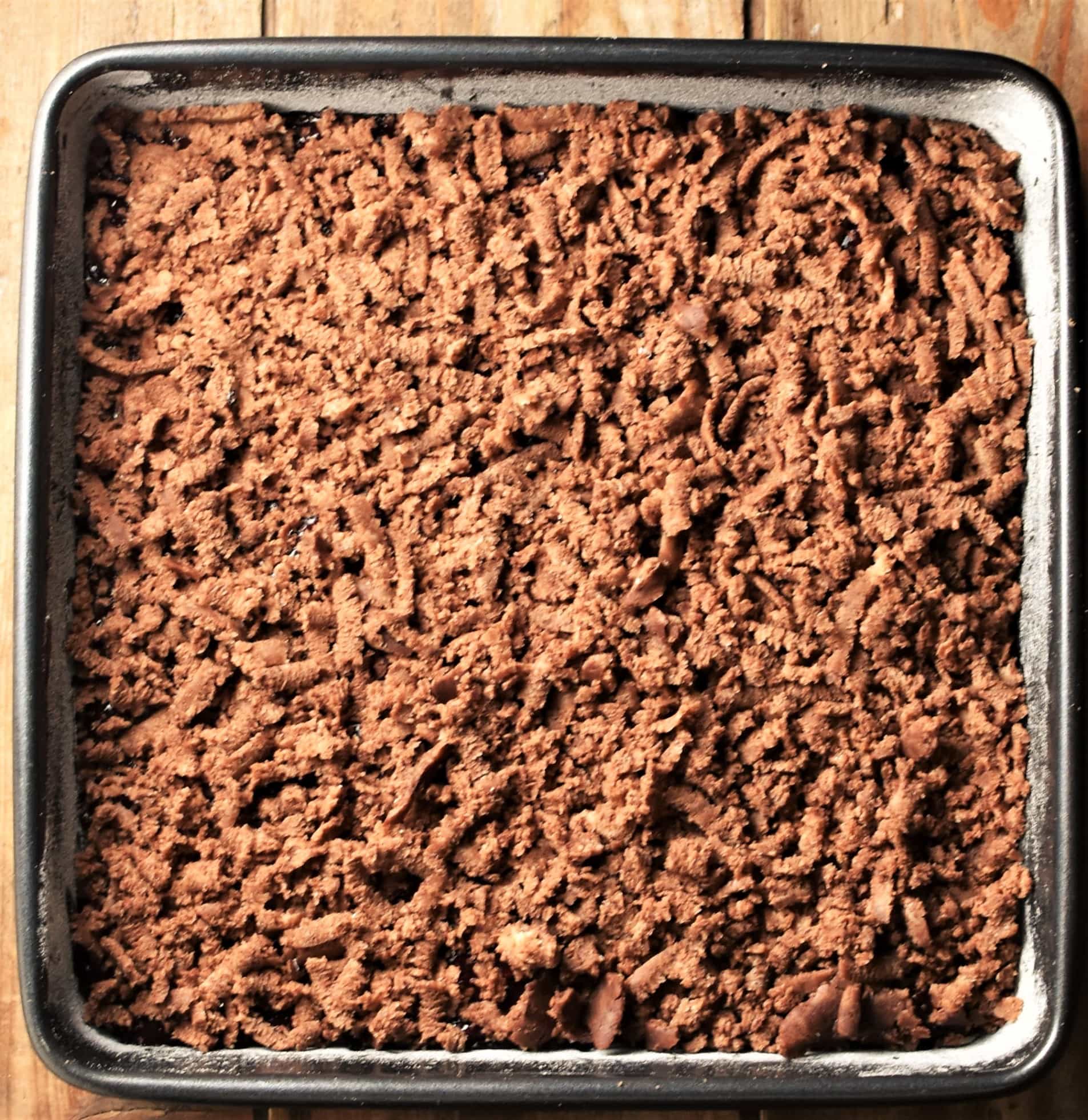 Cocoa crumb layer in square pan.