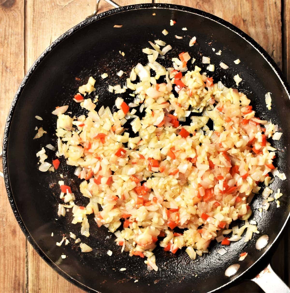 Chopped onion and pepper in large pan.