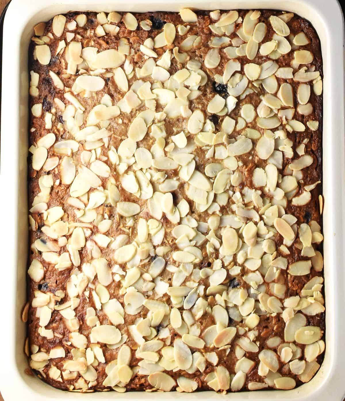 Bake blueberry banana oatmeal in white rectangular pan.
