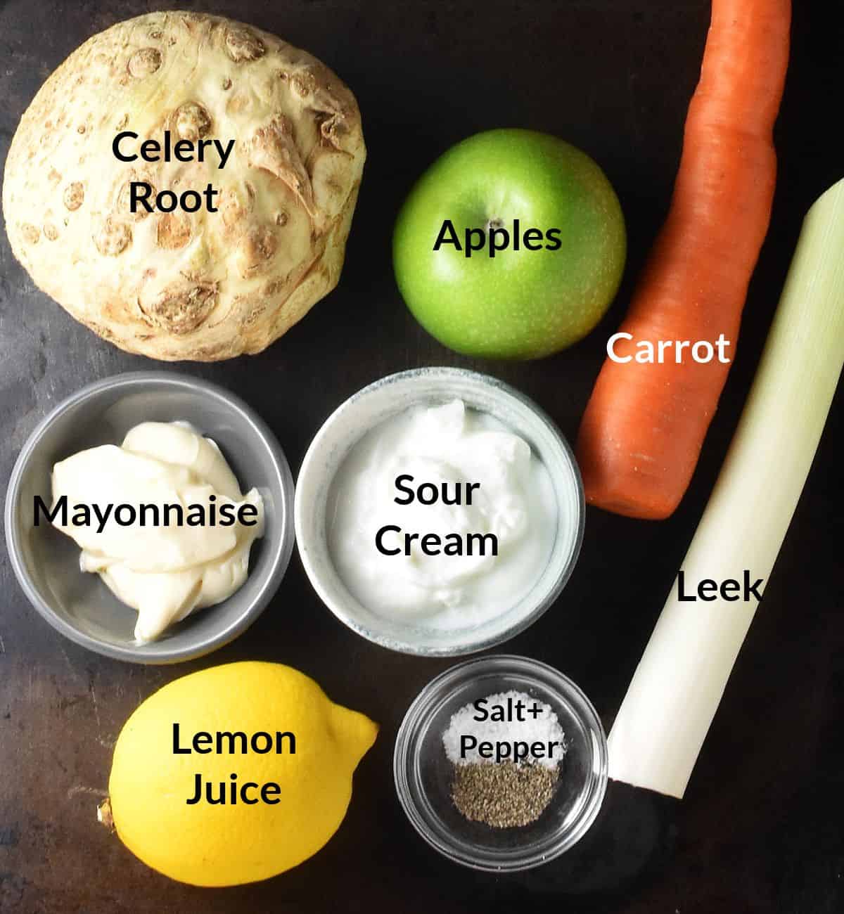 Top down view of ingredients for celery root slaw salad in individual dishes.