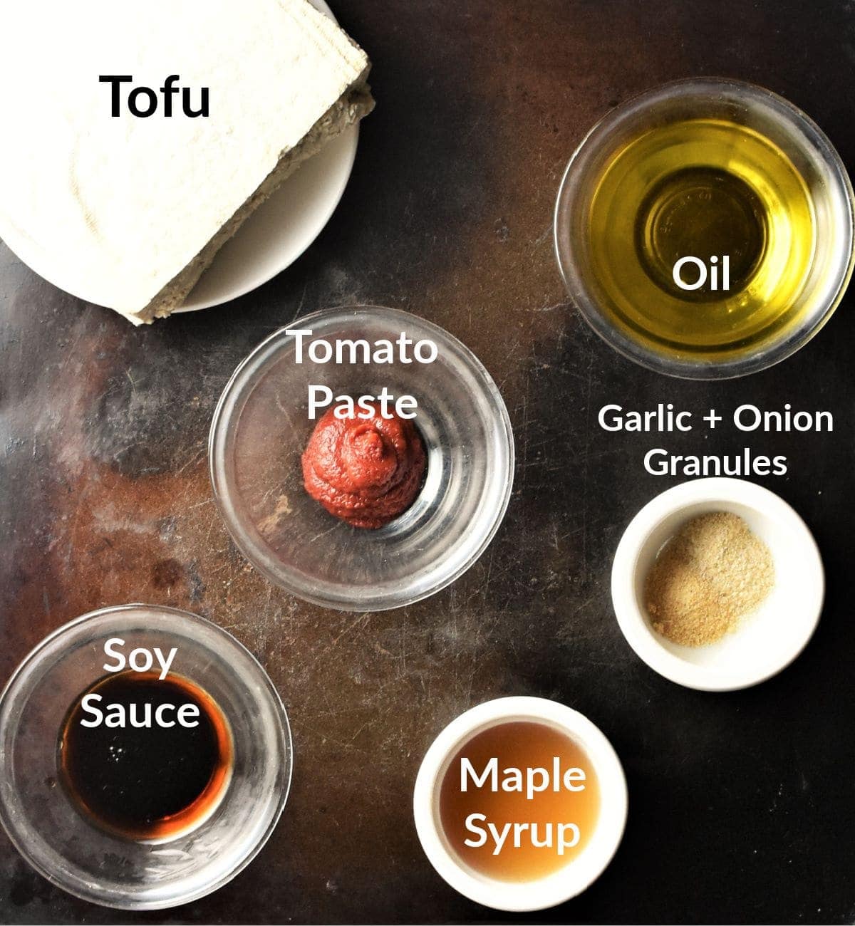 Ingredients for marinated tofu in individual dishes.