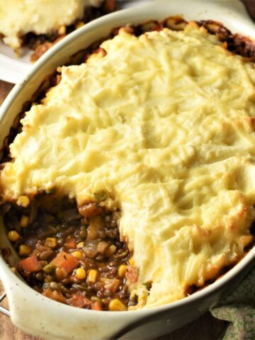 Lentil and vegetable shepherd's pie in oval dish.