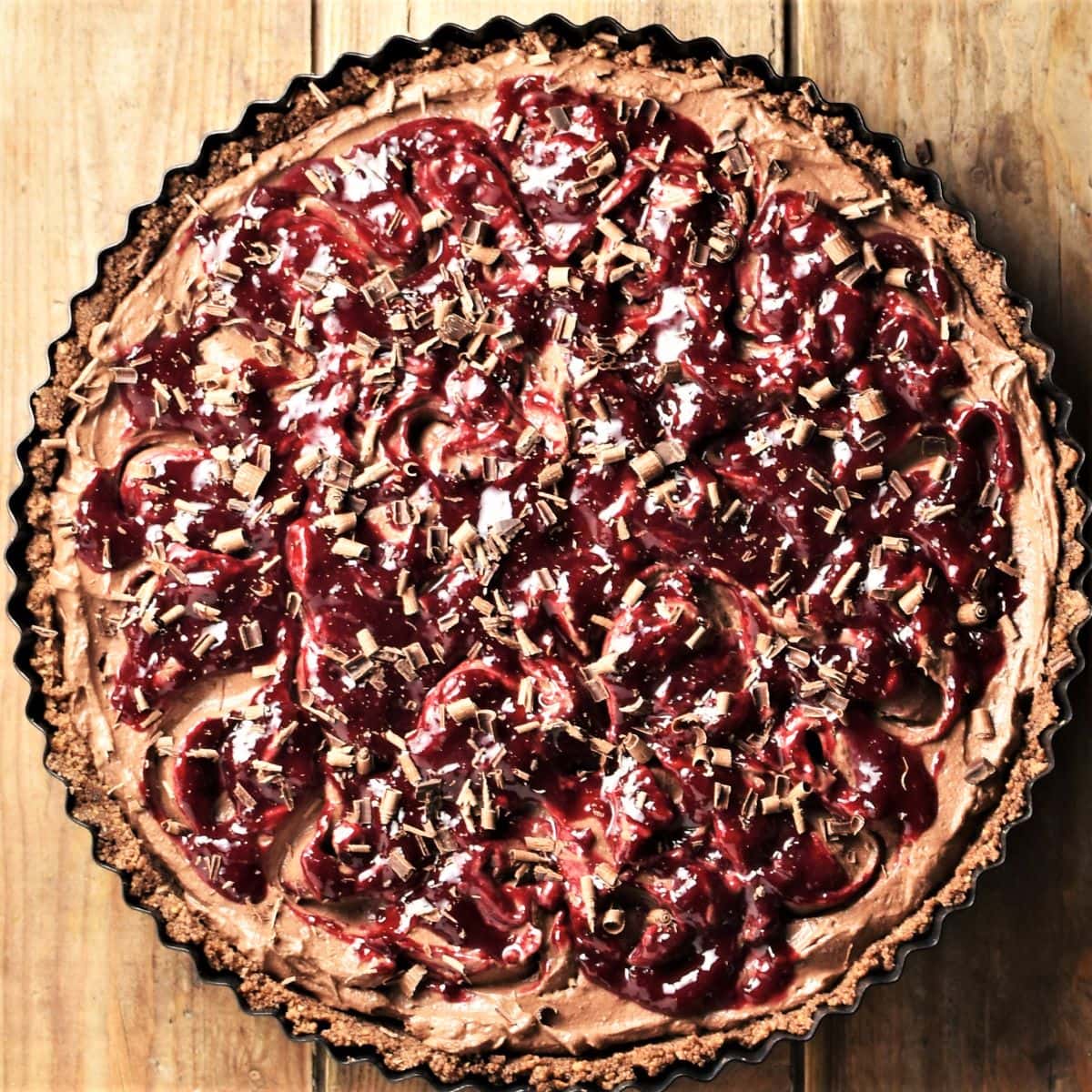 Black forest cheesecake tart in round tin.