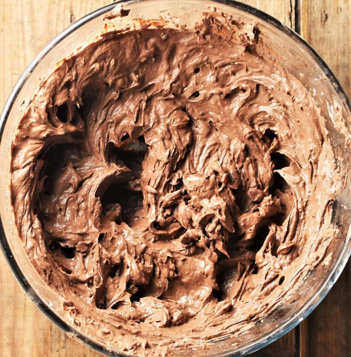 Chocolate cheesecake filling mixture in bowl.