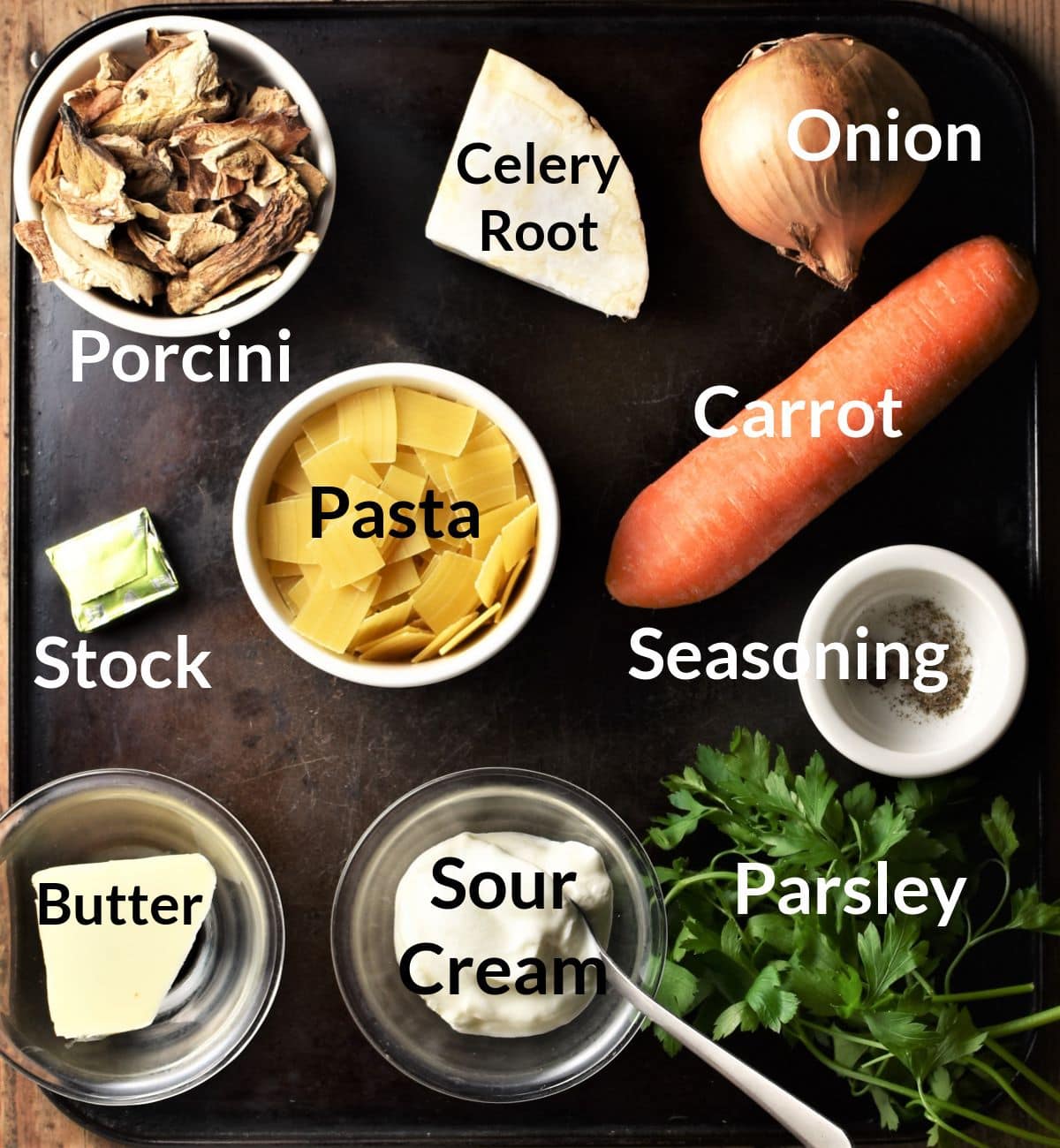 Polish mushroom soup ingredients in individual dishes.