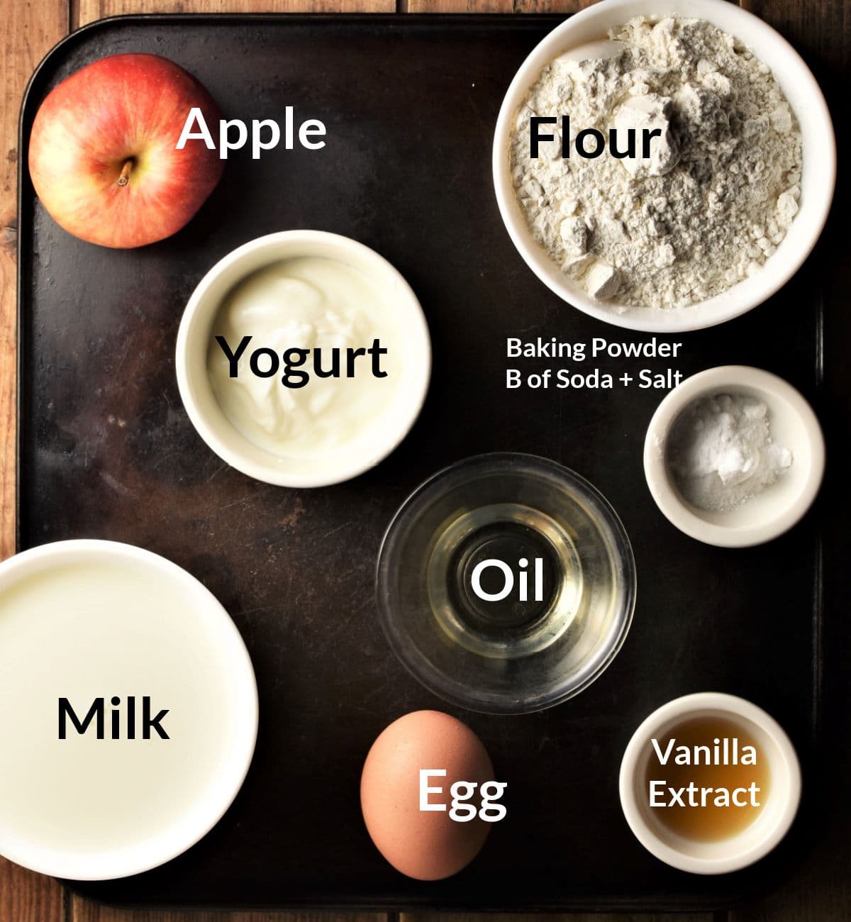 Ingredients for making Polish apple pancakes in individual dishes.