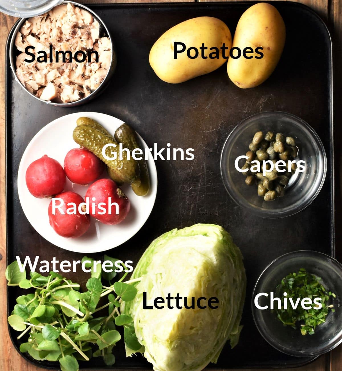 Ingredients for making salmon and potato salad in individual dishes.
